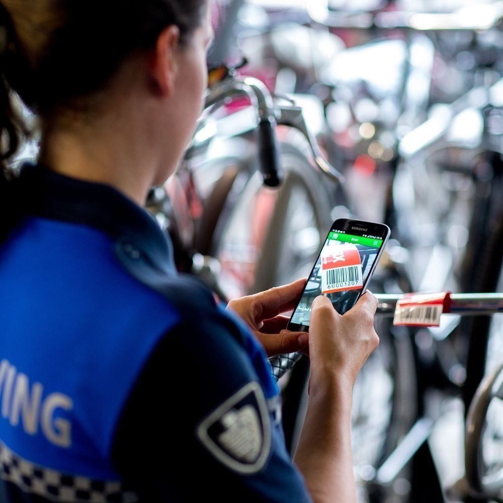 Enforcer takes photo of bike tag